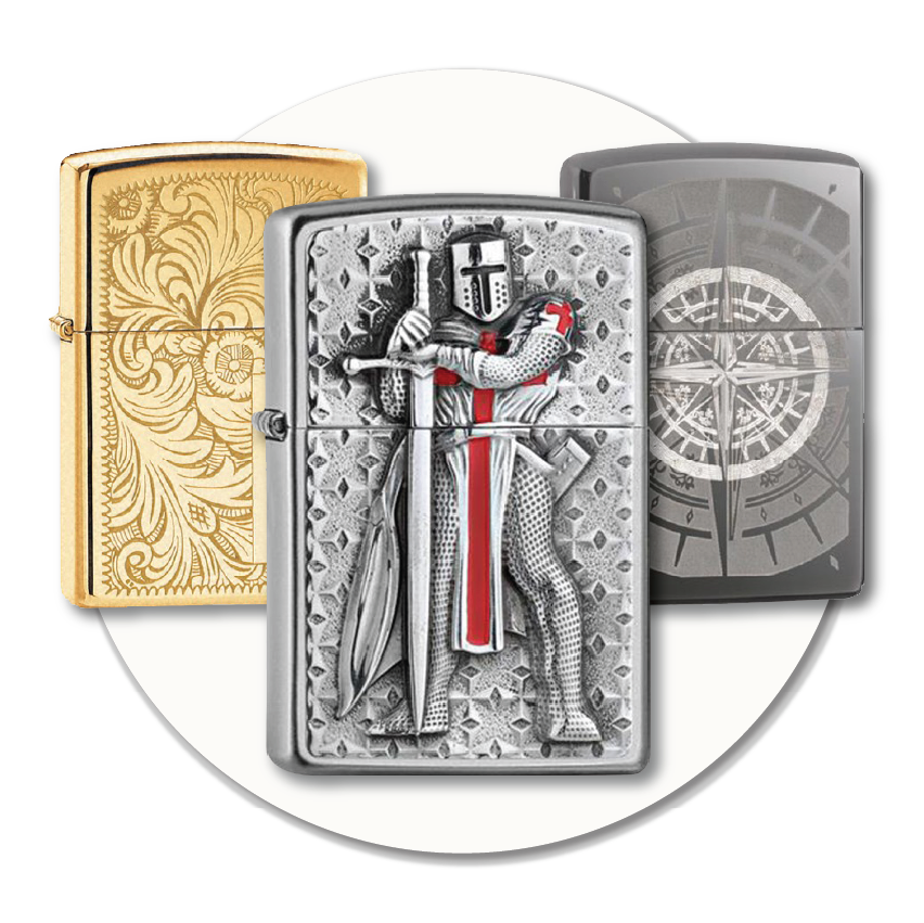 Three collectable Zippo lighters displayed together, including a brass engraved design, a crusader embossed lighter, and a dark compass-style Zippo—showing some of the gift and collector Zippos available at Sole to Sole.