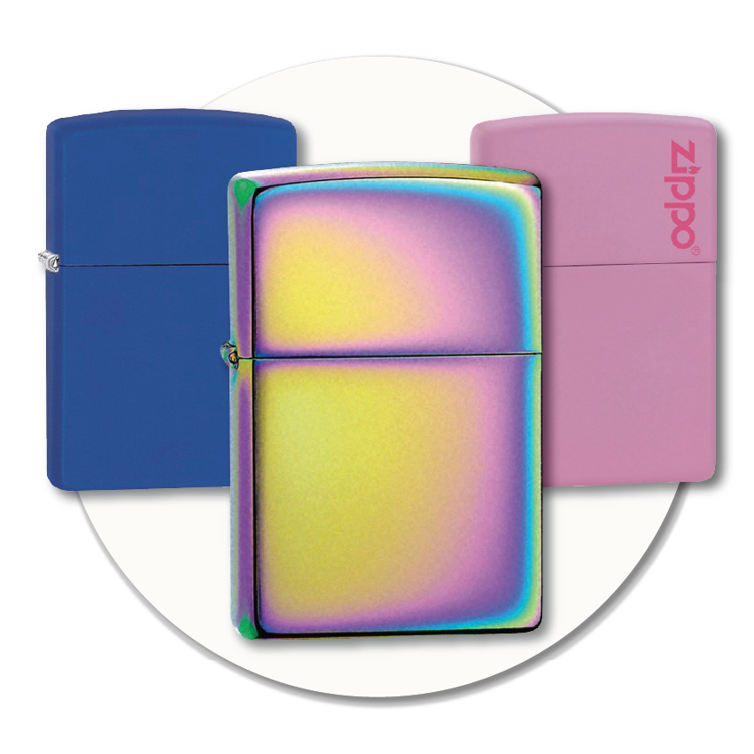 Three colourful Zippo lighters in blue, rainbow, and pink, displayed together to show some of the many Zippo options available to buy at Sole to Sole.