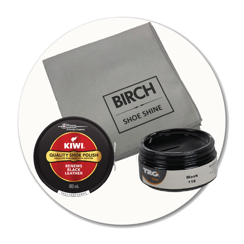 Product photo showing a tin of Kiwi black leather polish, an open pot of black shoe cream, and a shoe shine cloth — some of the professional shoe care and polishing products available at Sole to Sole in Stockport.