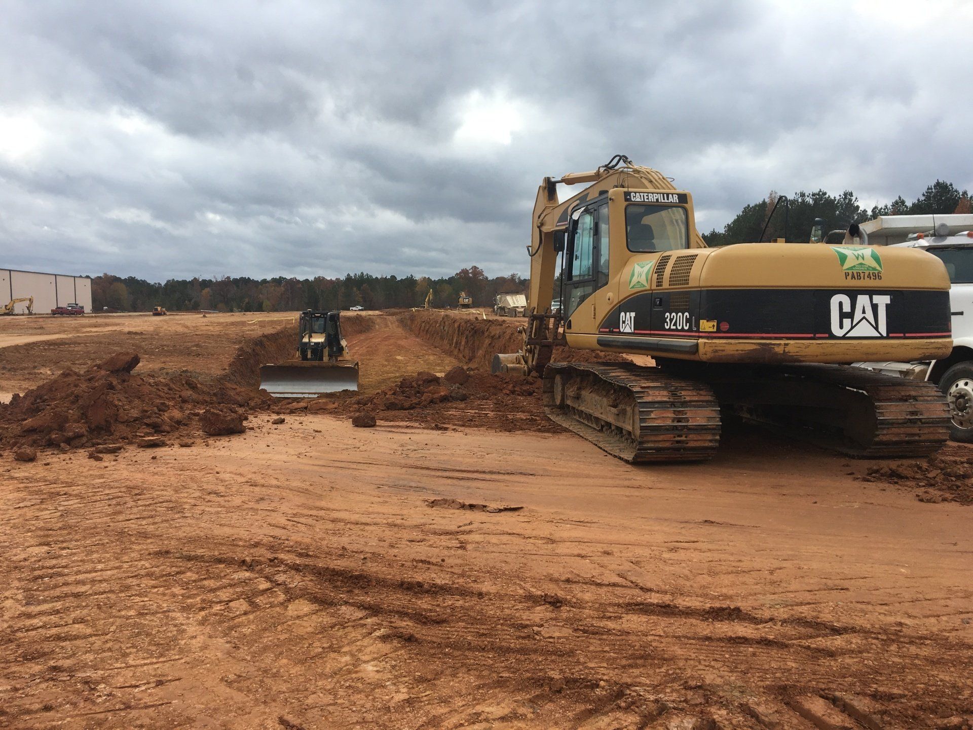 Roadway Construction Using Backhoe And Bulldozer — Judson, TX — W.R. Welborn & Son Inc.
