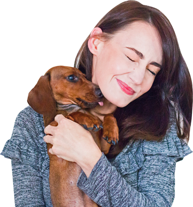 Woman holding her dachshund