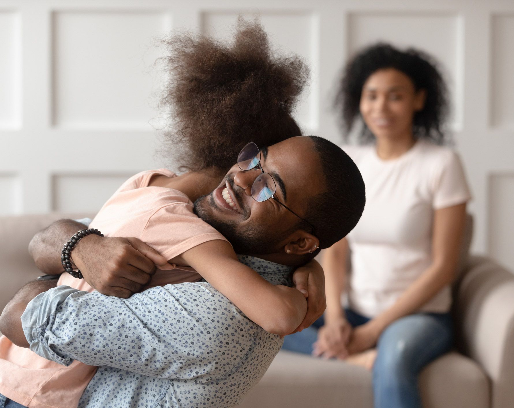 Father Hugging His Child And Mother Sitting — Fairlawn, OH — Susan Lax Law Office Father Hugging His Child And Mother Sitting — Fairlawn, OH — Susan Lax Law Office