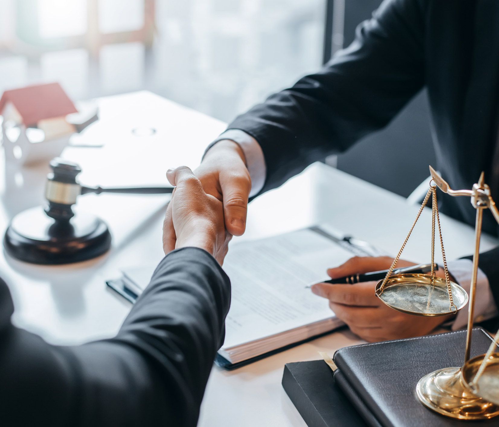 Attorney And Client Hand Shaking — Fairlawn, OH — Susan Lax Law Office Attorney And Client Hand Shaking — Fairlawn, OH — Susan Lax Law Office