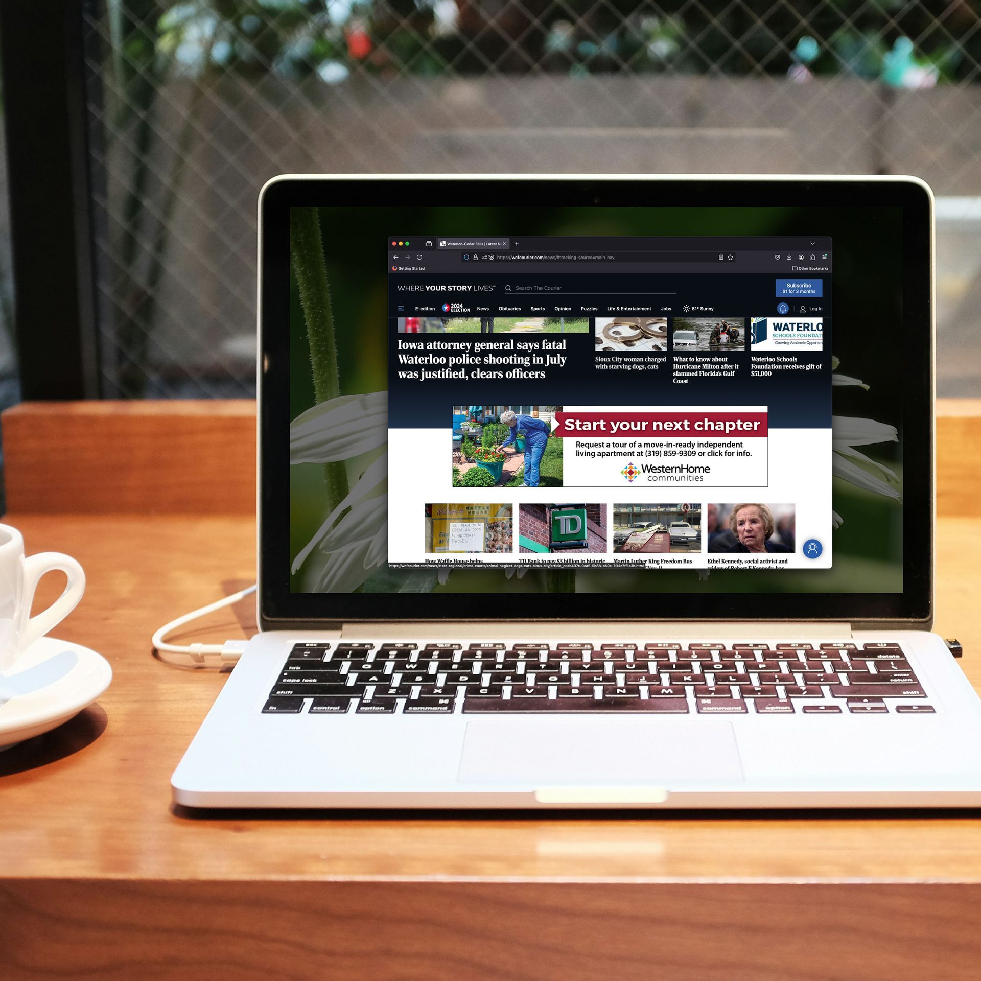 A laptop is open to a page that says start your next chapter