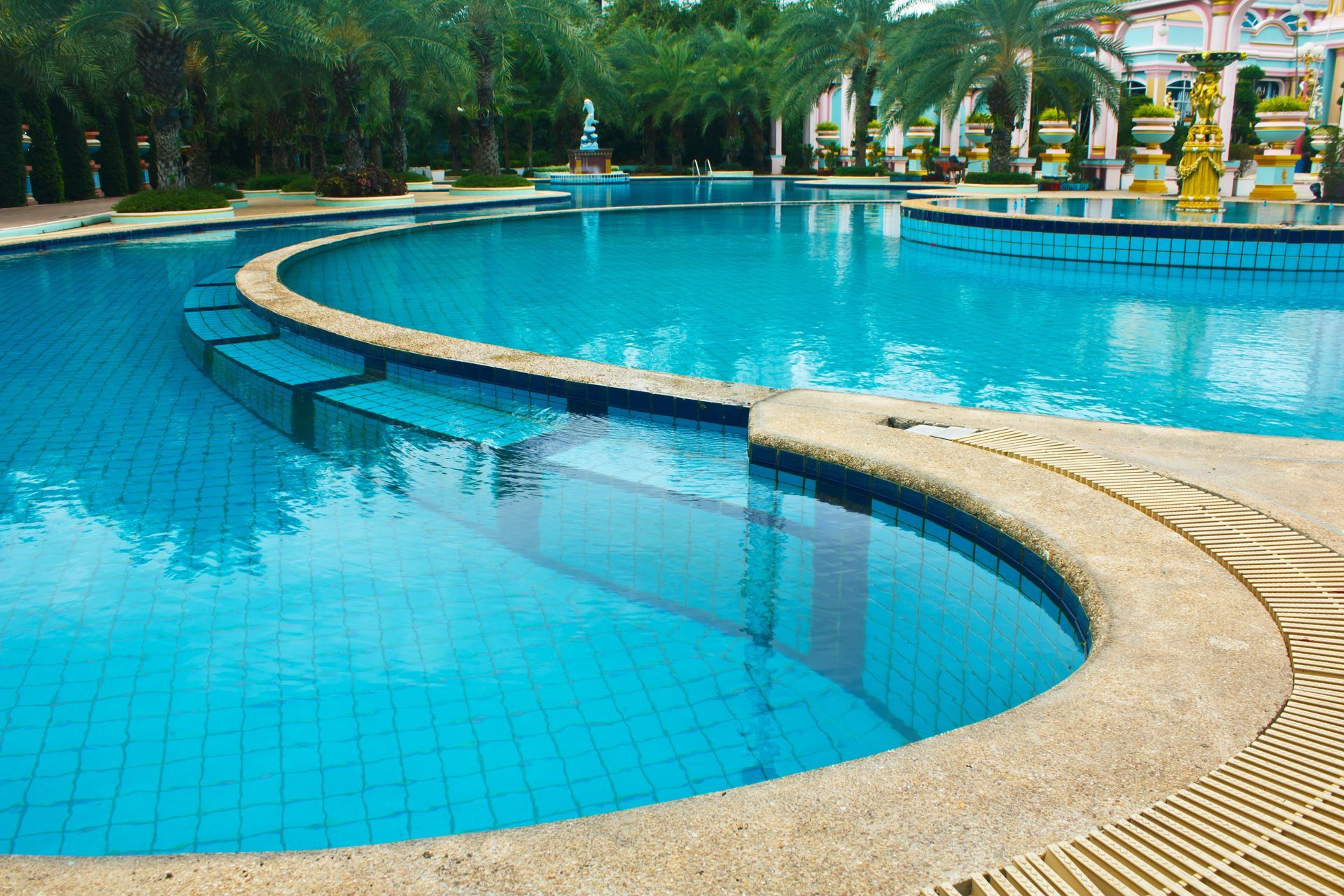 A large swimming pool with stairs leading up to it