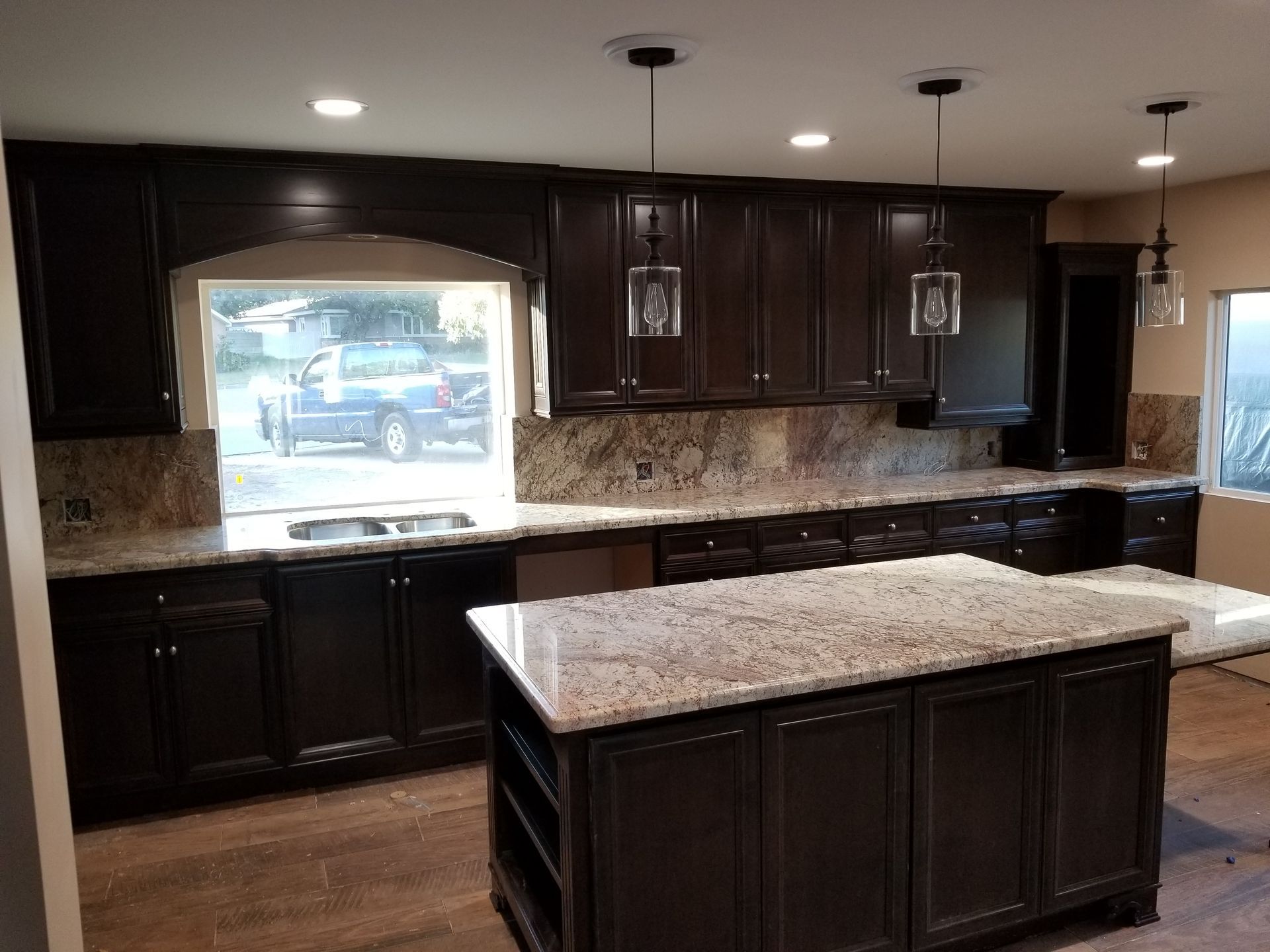A kitchen with a large island in the middle of it.