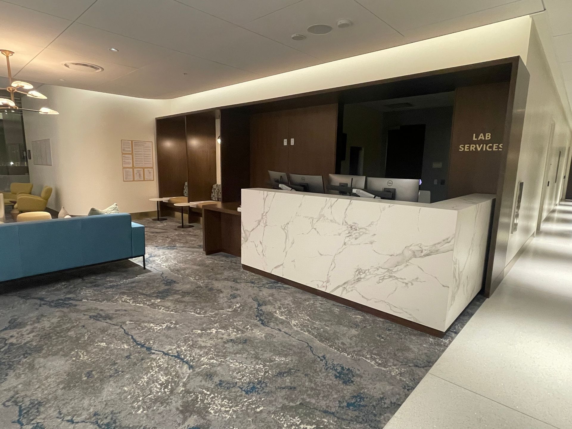 There is a marble counter in the middle of the room.