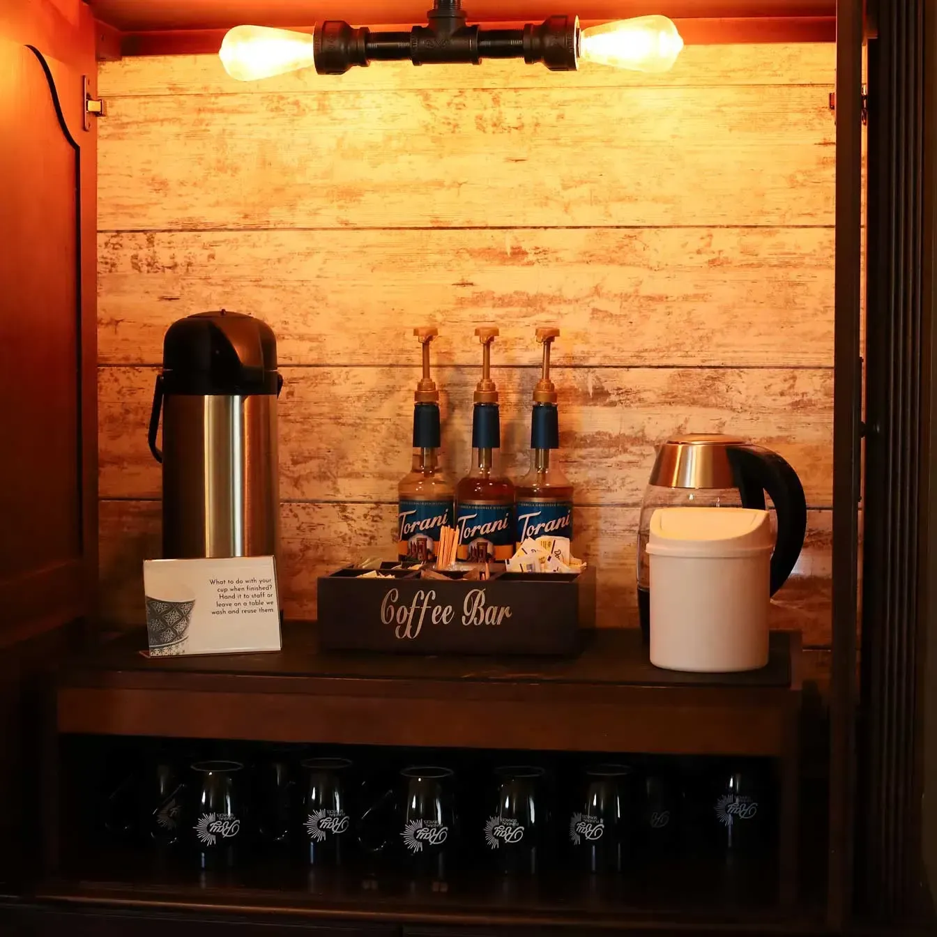 A church with rows of wooden benches and a podium