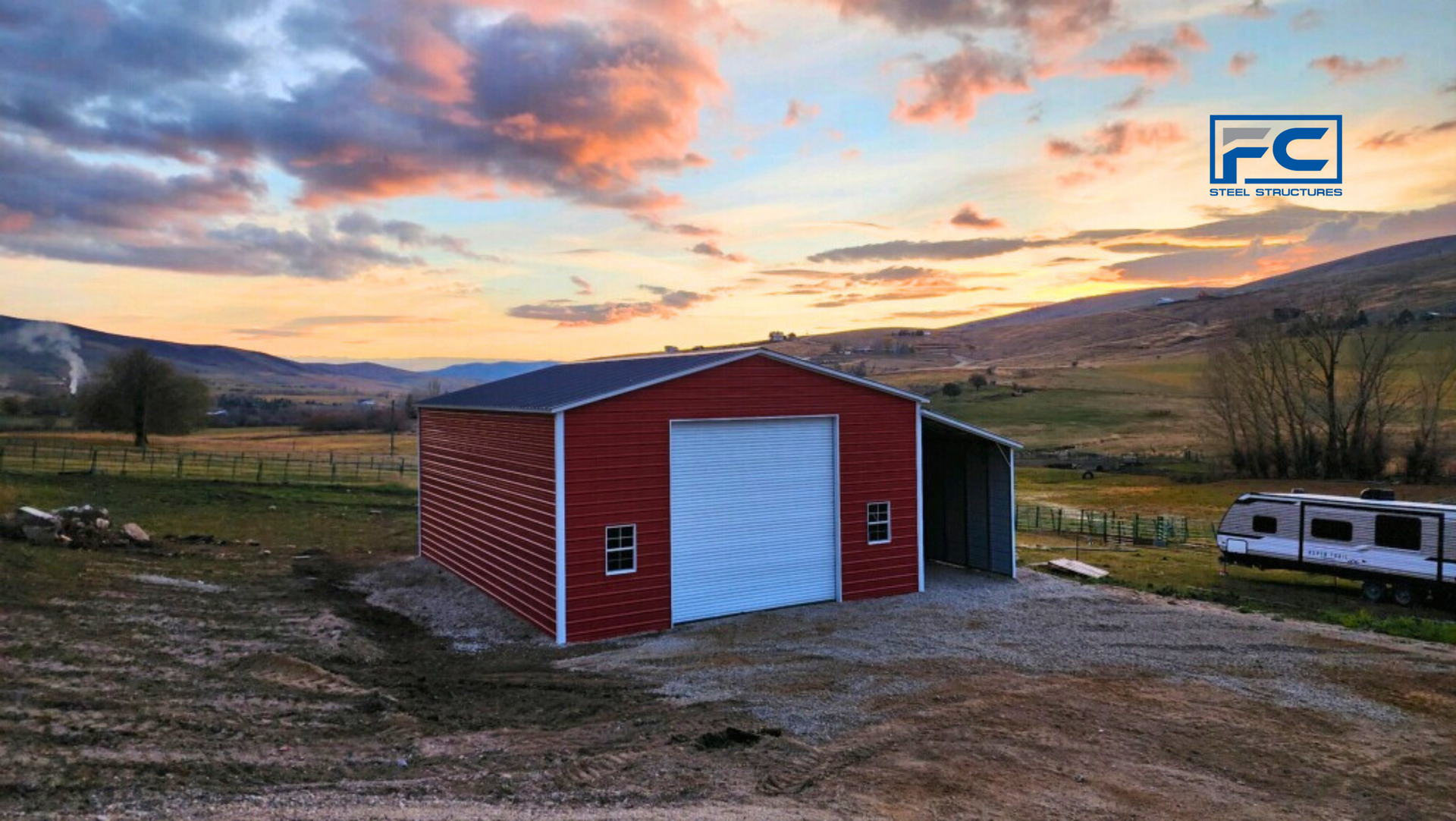 A red barn with a white door is sitting in the middle of a field.