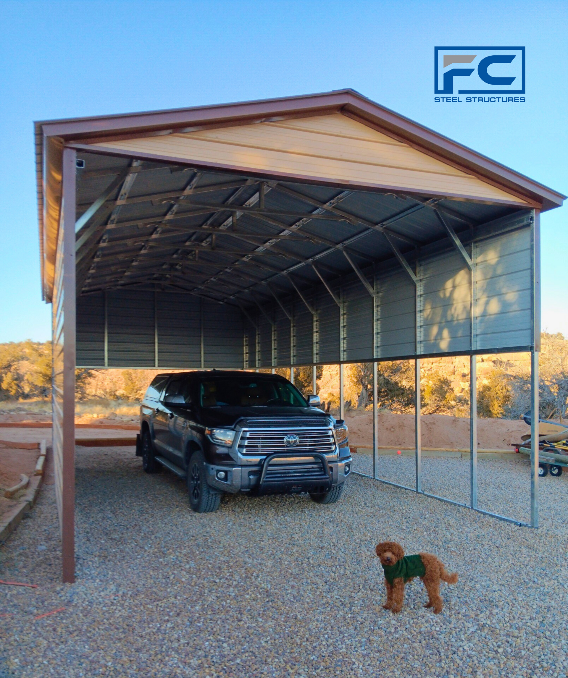 A ford truck is parked under a metal carport