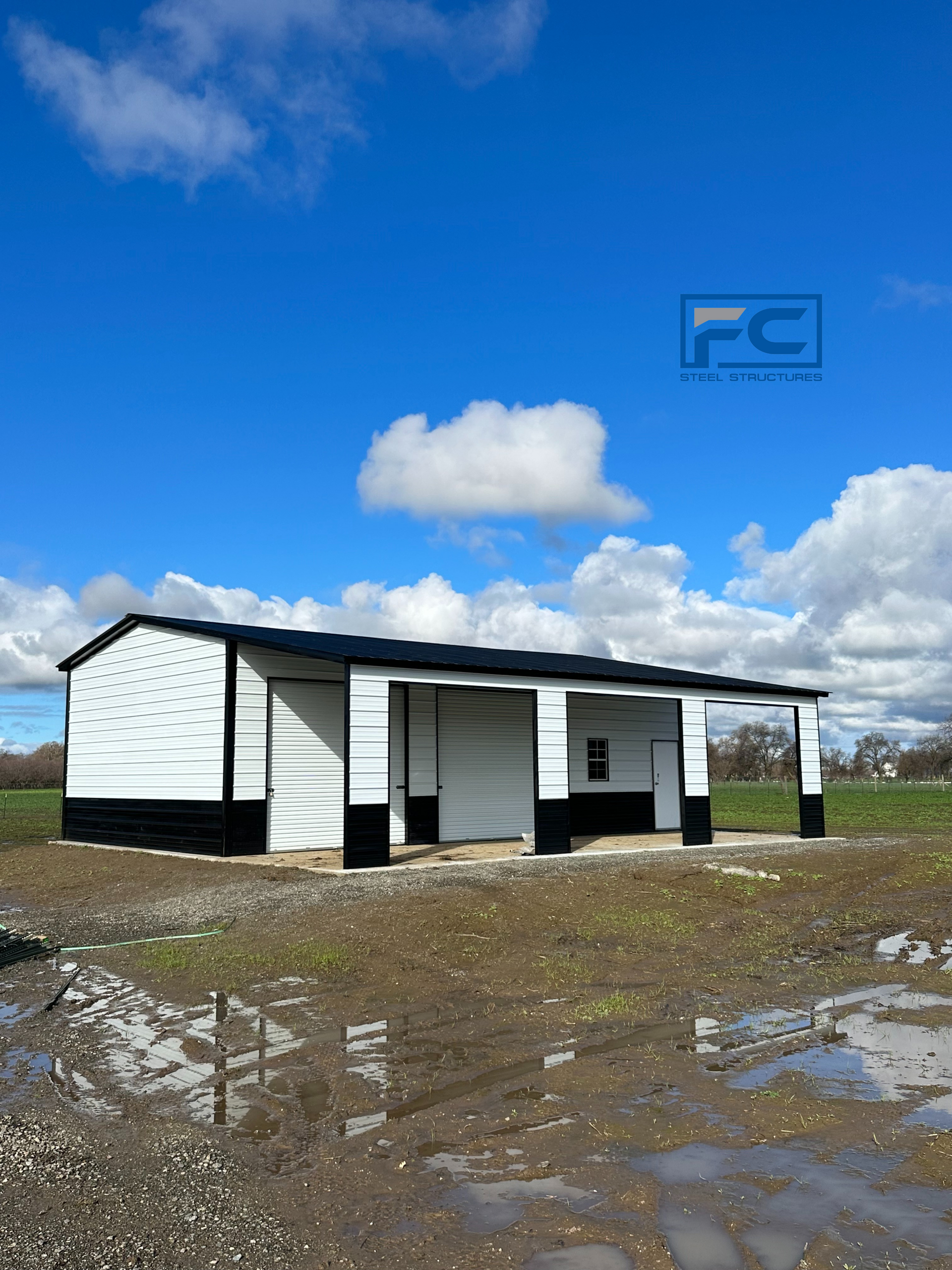 A white and black building with fc written on the bottom