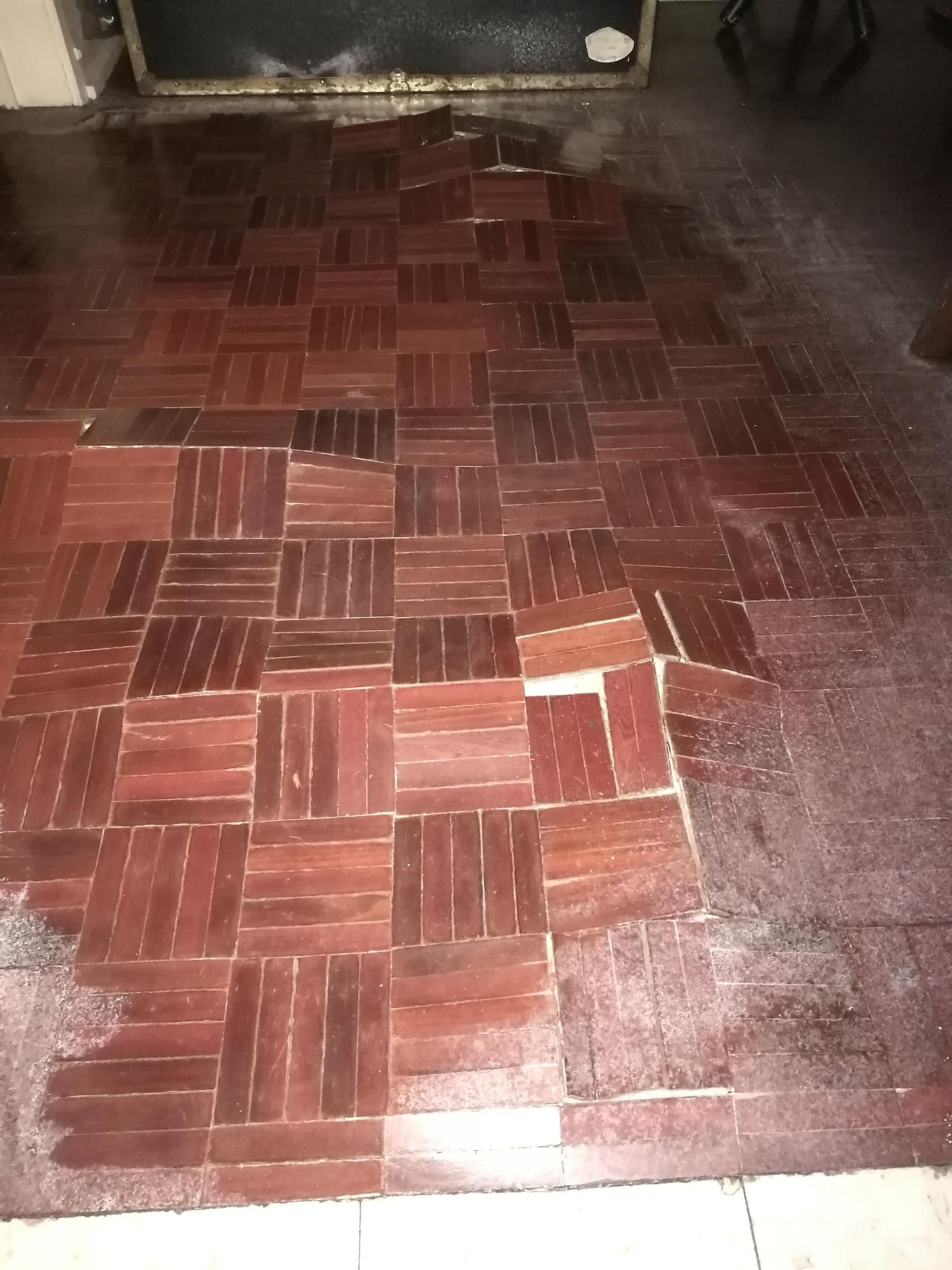 a wooden floor with a pattern of squares on it