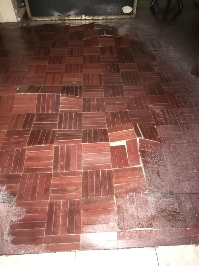a wooden floor with a pattern of squares on it