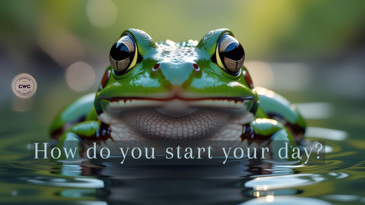A calm frog in shallow water is looking us in the eye, with the words how do you start your day?'