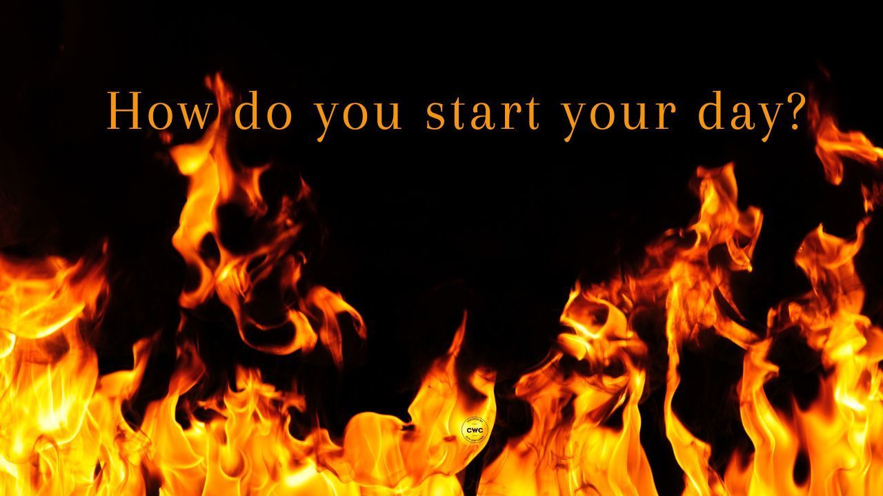 Orange flames licking up to the words 'how do you start your day?' against a dark background