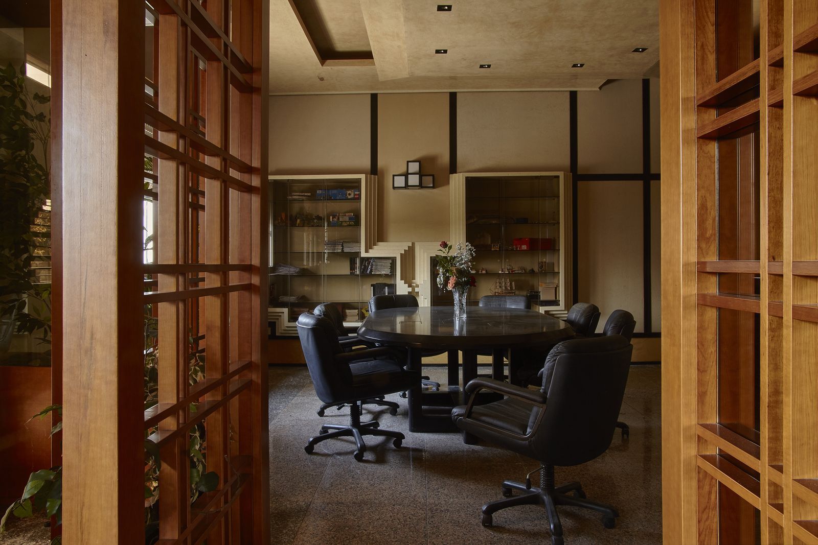 A conference room with a table and chairs in it
