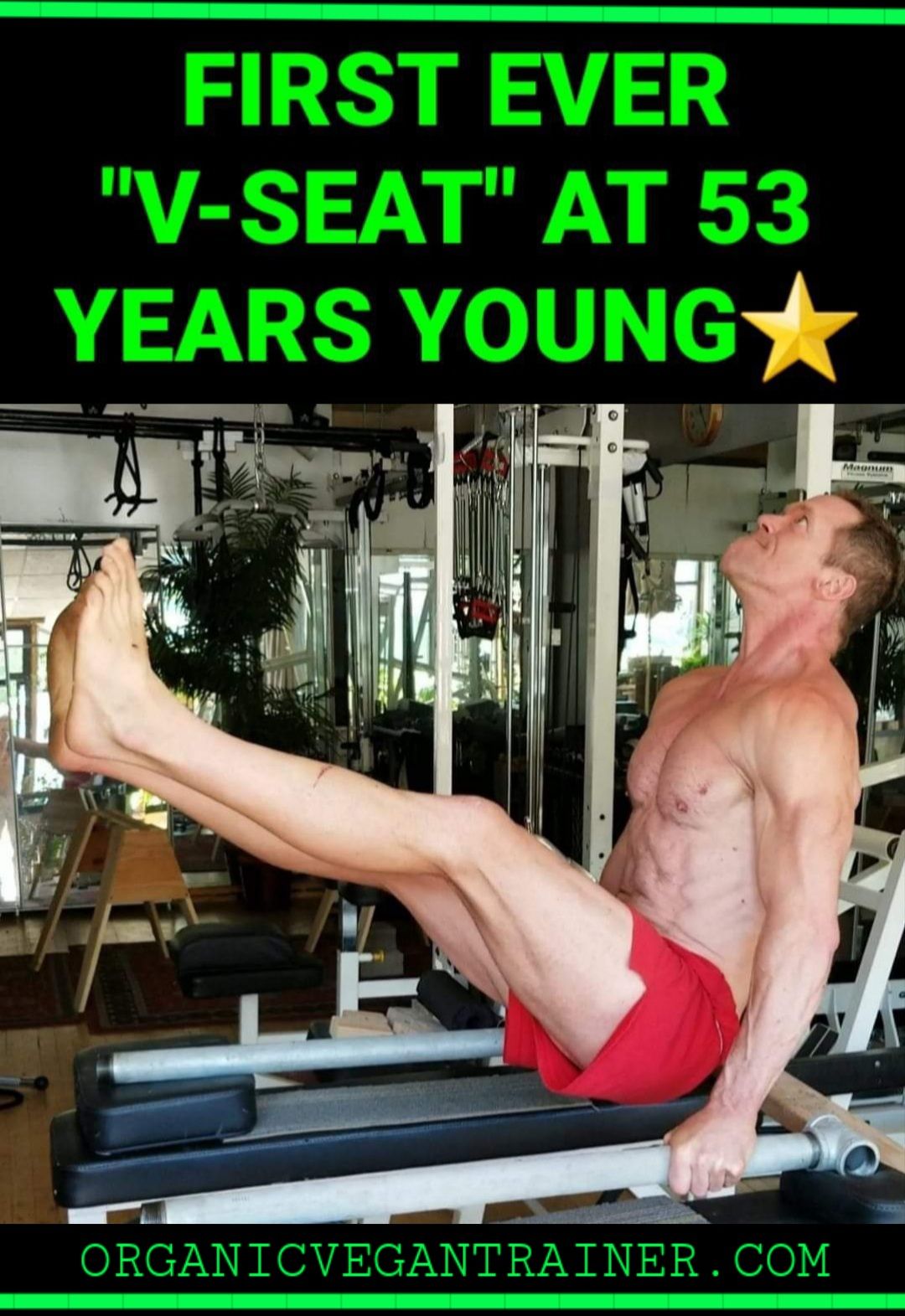 A man is doing a v-seat exercise in a gym