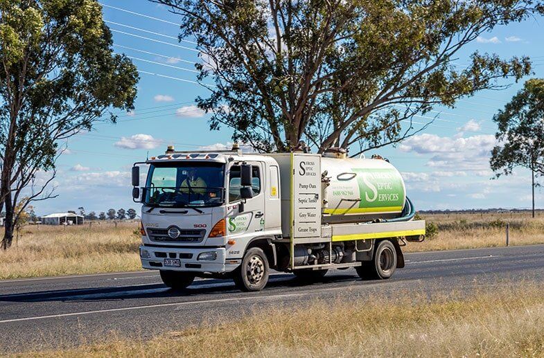 Septic tank cleaner Truck on long road in Toowoomba, QLD