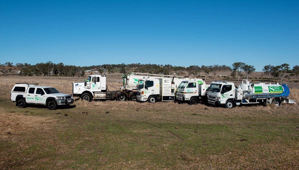 Five White Shreks Septic Services Truck 