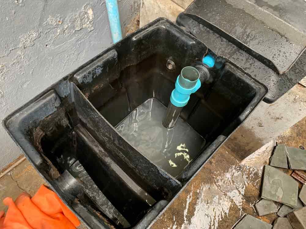 Grease Trap Behind A Commercial Building