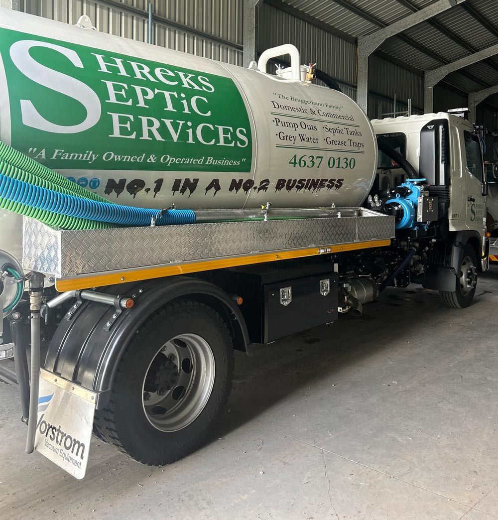 Septic Tank Truck Parked Inside a Garage