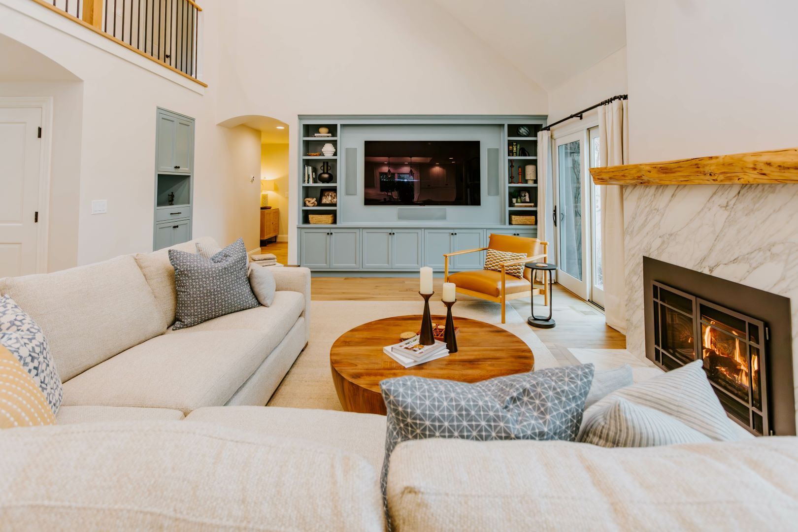 A living room filled with furniture and a fireplace.
