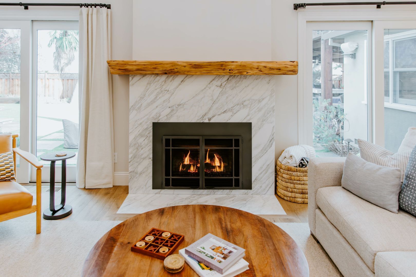 There is a fireplace in the middle of the living room.