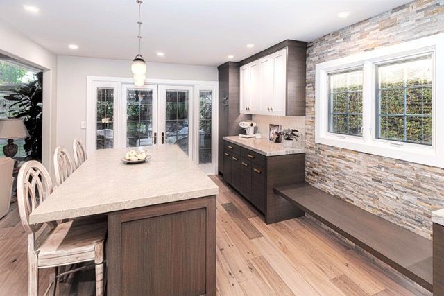 There is a large island in the middle of the kitchen.