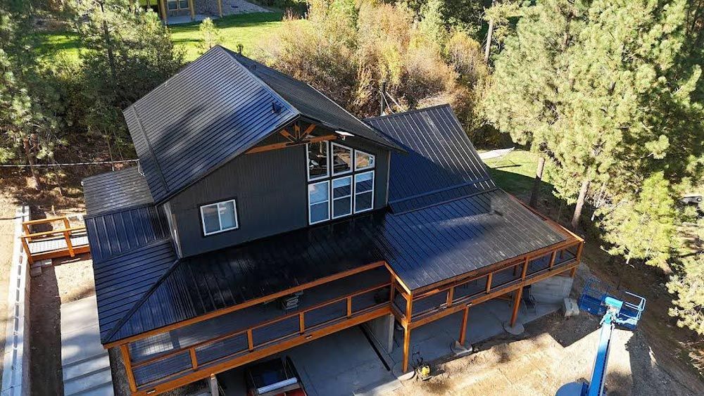 Aerial View of A House with Black Metal Roof