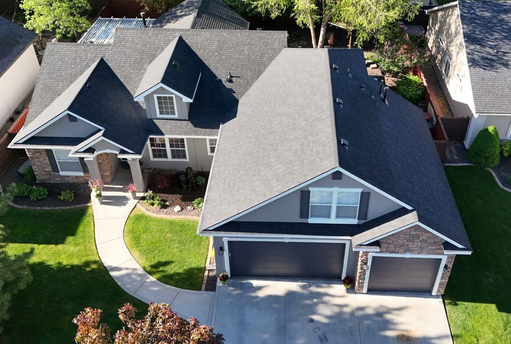 Home with Garage Highlighting Roof Replacement