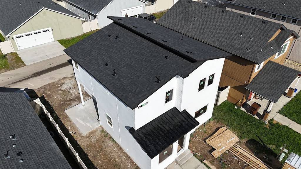 White-Painted House with Black Roof Shingles