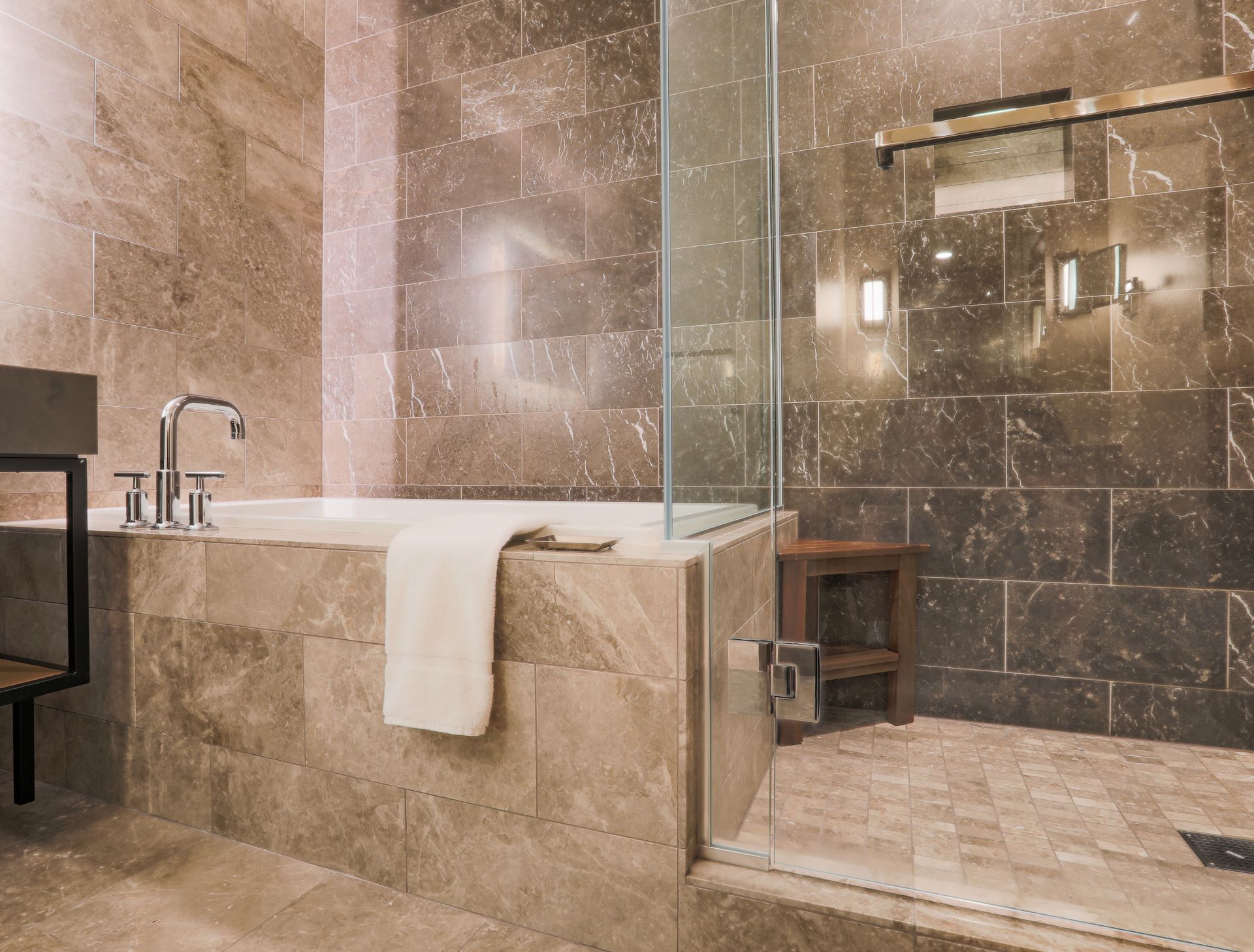 Modern Marble Tiled Bathroom with walk-in shower and tub showing