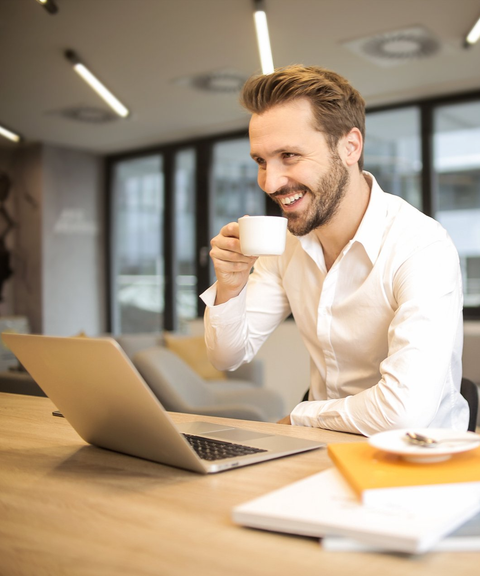 smiling business man with laptop