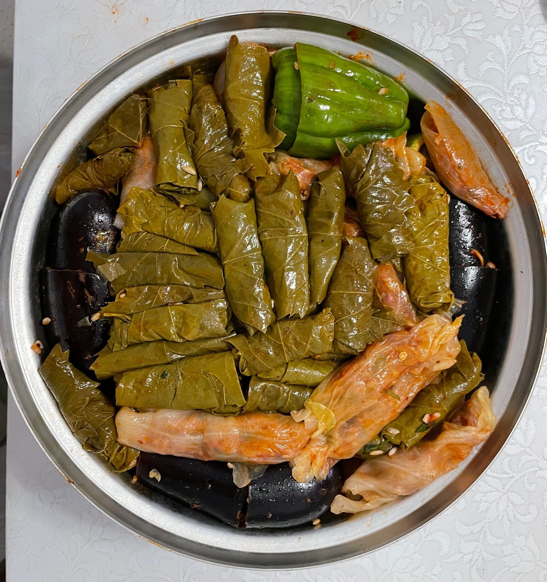 Pot of Turkish Dolmas, stuffed cabbage & peppers, traditional Mediterranean dish.