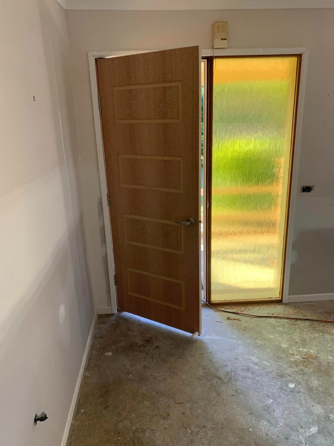 A Room with A Wooden Door and A Glass Door — Coastal Homes & Renovations in South West Rocks, NSW