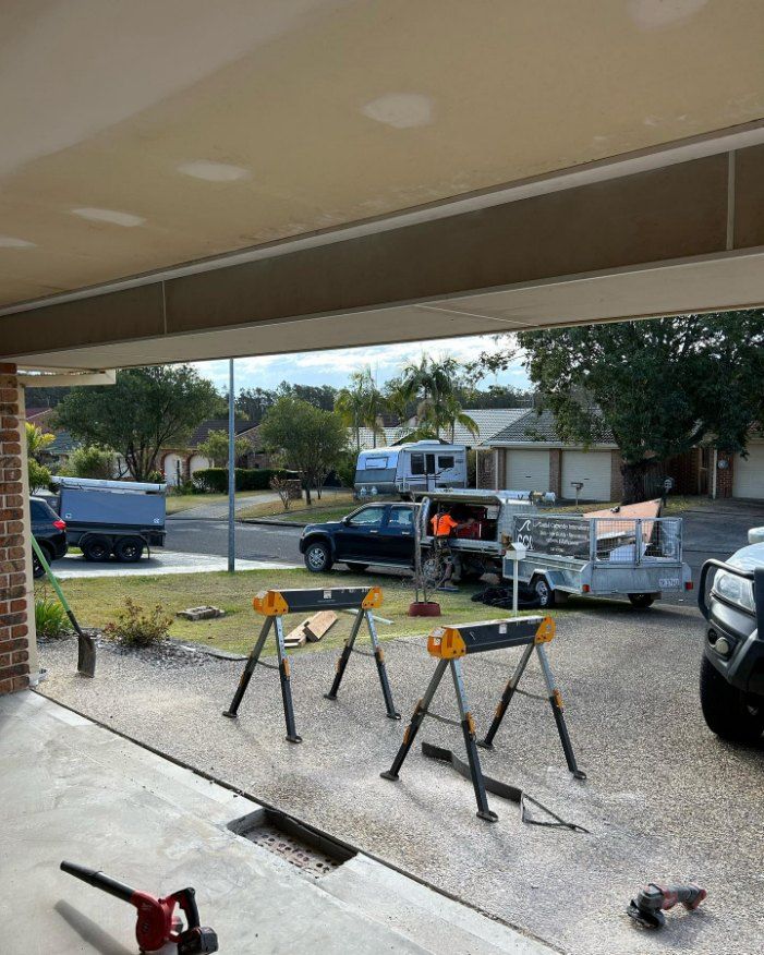 A Car Is Parked in The Driveway of A House — Coastal Homes & Renovations in Wauchope, NSW