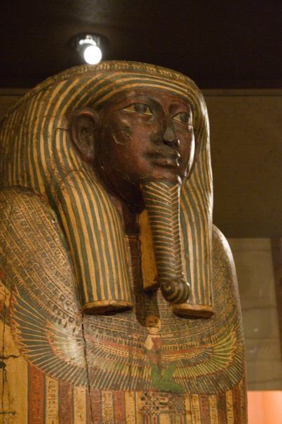 A close up of a statue of a man with an elephant trunk.