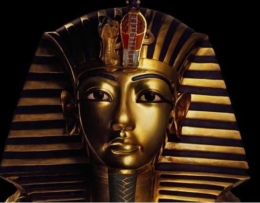 A close up of a statue of a pharaoh 's face