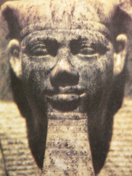 A close up of a statue of a man 's face