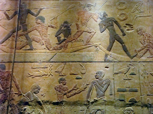 A painting of a group of people on a wall