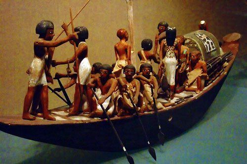 A model of a boat with a group of people on it