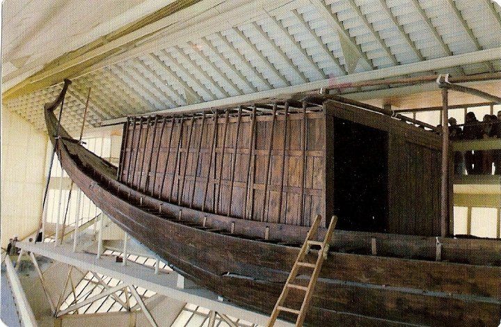 A large wooden boat with a ladder attached to it