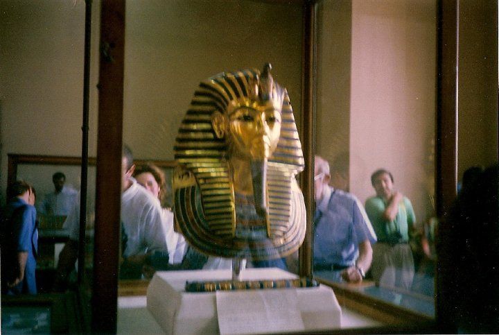 A statue of a pharaoh 's head is on display in a museum