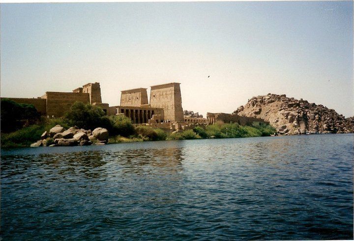 A large body of water with a large building in the background