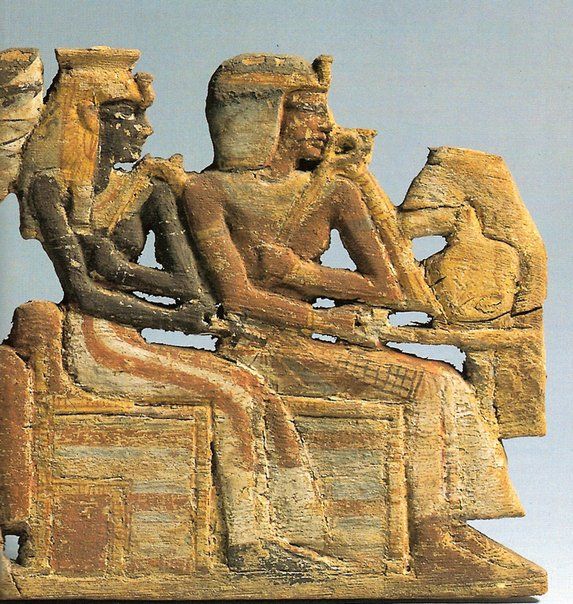 A statue of a man and woman sitting next to each other