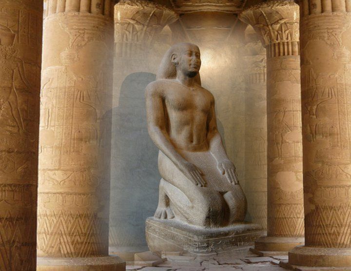 A statue of a man kneeling in front of columns