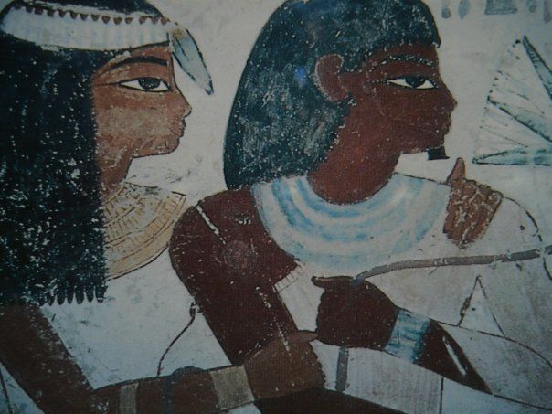 A painting of a man and a woman with feathers on their heads