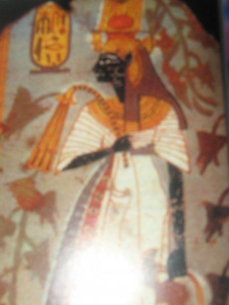 A painting of a man with a cat on his head