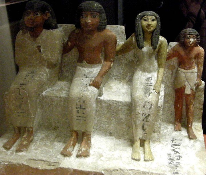 A group of statues are sitting next to each other and one of the statues says life