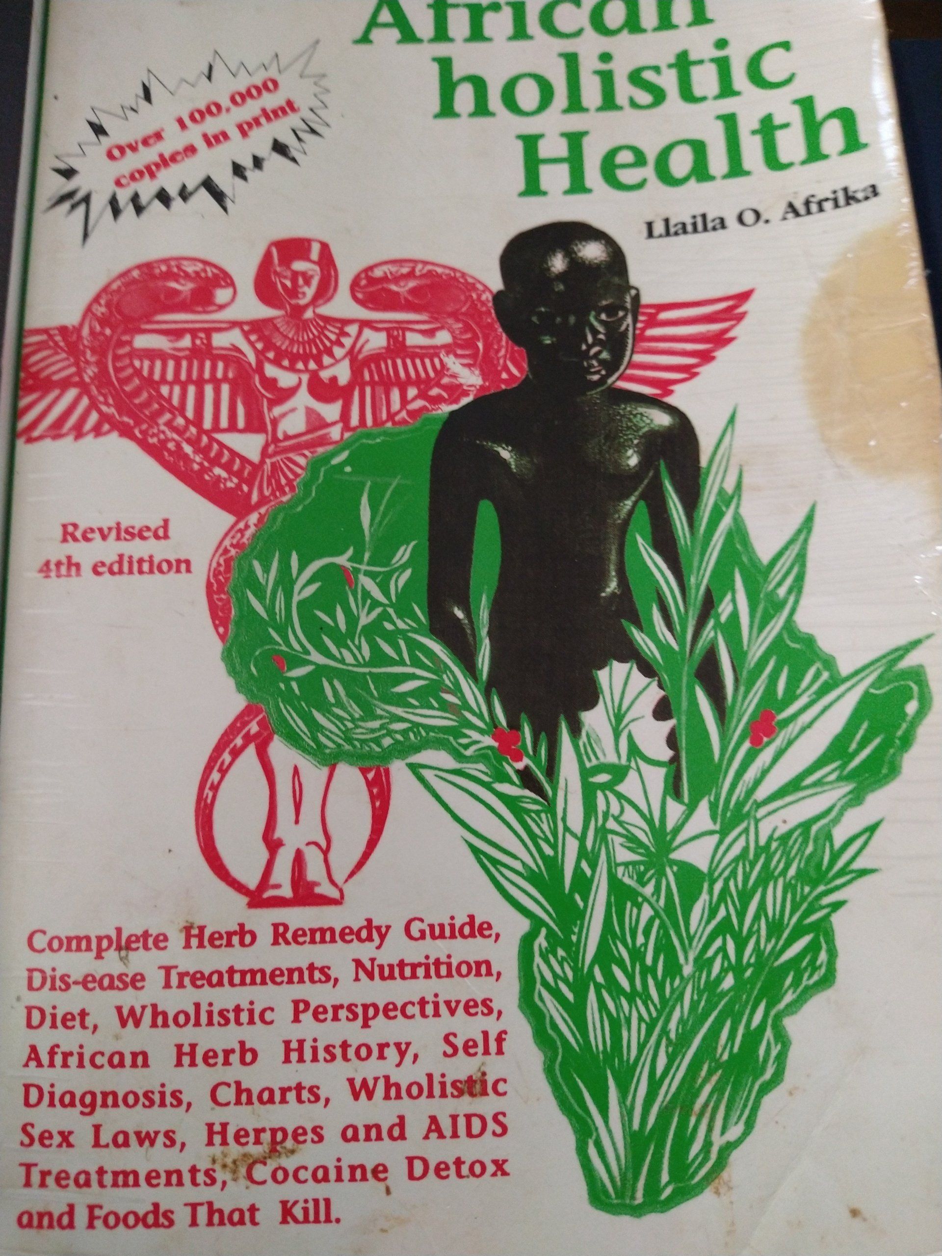 A book titled african holistic health has a man on the cover